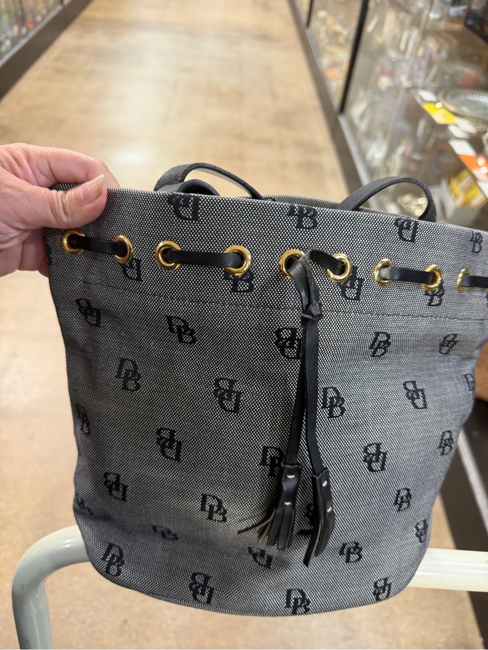 Dooney & Bourke Black Logo Drawstring Bucket Bag with Gold Hardware